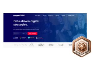Megaphone marketing homepage with a statement 'Data-driven digital strategies' and a team holding an award, alongside a bronze badge for 'Best Influencer Marketing Agencies 2024.