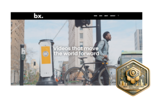 Best Video Production Companies gold award badge displayed on BX Films website with the headline 'Videos that move the world forward'