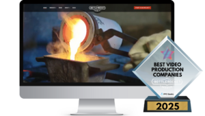 A computer screen displaying Bottle Rocket Media’s homepage with an image of molten metal being poured, and a Best Video Production Companies 2025 award in the foreground.