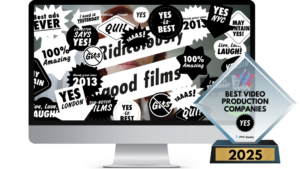 Computer screen showing a chaotic collage of bold text and graphics from YES’s homepage, with an award for Best Video Production Companies 2025 in the foreground.