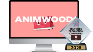 A computer screen displaying Animwood’s homepage with a cheerful red animated character and a Best Video Production Companies 2025 award in the foreground.