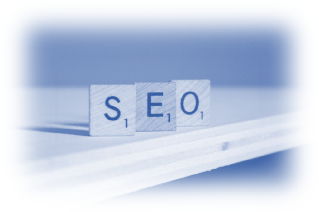 Wooden letter blocks spelling SEO stacked on a reflective surface, symbolising the Future of SEO.